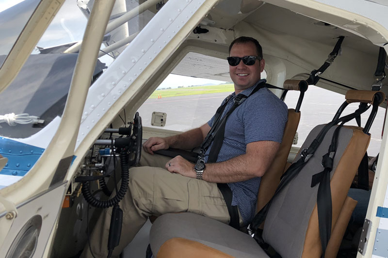 Stephen Sweeney in a small aircraft